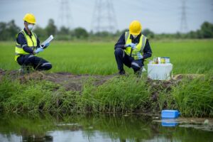 Environmental researchers investigate the condition of canal water